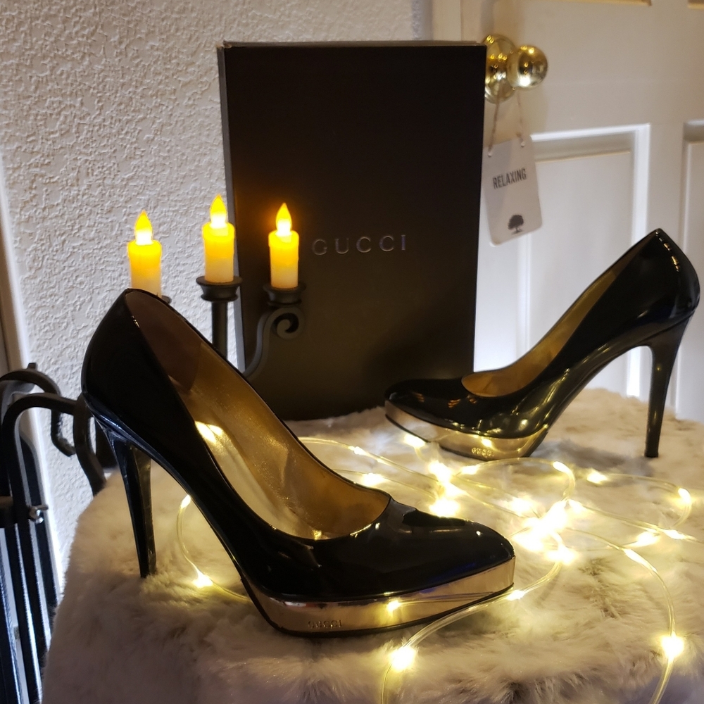 Black patent GUCCi pumps with gold hardware